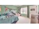 Cozy bedroom with a window, featuring sports-themed decor and a comfortable loveseat at 456 Rockford Sw Pass, Marietta, GA 30064
