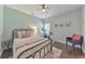 Cozy bedroom with stylish furnishings, a ceiling fan, and hardwood floors at 456 Rockford Sw Pass, Marietta, GA 30064