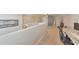 Bright bonus room featuring neutral tones, a ceiling fan, and a sliding barn door to the ensuite bathroom at 456 Rockford Sw Pass, Marietta, GA 30064