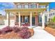 Inviting front porch featuring brick accents, seating area and beautiful landscaping with address number 456 at 456 Rockford Sw Pass, Marietta, GA 30064