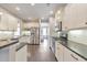 Modern kitchen with stainless steel appliances, white cabinetry and hardwood floors at 456 Rockford Sw Pass, Marietta, GA 30064