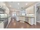 Bright kitchen features stainless appliances, dark countertops, white cabinets, and hardwood floors at 456 Rockford Sw Pass, Marietta, GA 30064