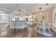 Bright kitchen and breakfast nook with bar seating, white cabinetry and hardwood floors at 456 Rockford Sw Pass, Marietta, GA 30064