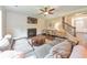Cozy living room with fireplace, ceiling fan, and comfortable seating area at 456 Rockford Sw Pass, Marietta, GA 30064