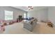 Spacious living room with a sofa, multiple windows, and room for a variety of furniture at 456 Rockford Sw Pass, Marietta, GA 30064