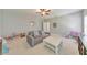 Bright, spacious living room with large sofa, ample natural light and neutral walls at 456 Rockford Sw Pass, Marietta, GA 30064