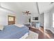 Spacious main bedroom features tray ceilings, hardwood floors, and a ceiling fan at 456 Rockford Sw Pass, Marietta, GA 30064