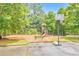 Community playground with swings, a slide and a basketball court, perfect for Gathering fun at 456 Rockford Sw Pass, Marietta, GA 30064
