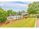 Community Pool with lounge chairs and umbrellas for relaxing on a sunny day at 456 Rockford Sw Pass, Marietta, GA 30064