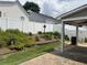 Backyard patio with well-maintained landscaping and a white vinyl privacy fence providing seclusion at 804 Village Pl, Loganville, GA 30052