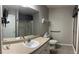 Bathroom featuring a single vanity, tile flooring, and walk-in shower at 804 Village Pl, Loganville, GA 30052