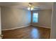 Cozy bedroom with wood floors and natural light at 804 Village Pl, Loganville, GA 30052