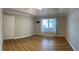 Spacious bedroom with wood floors, tray ceiling, and natural light at 804 Village Pl, Loganville, GA 30052