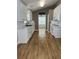 Bright kitchen featuring white cabinets, stainless appliances, and a view into the breakfast nook at 804 Village Pl, Loganville, GA 30052