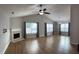 Bright living room with vaulted ceilings, fireplace, wood floors, and ample natural light at 804 Village Pl, Loganville, GA 30052