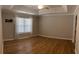 Spacious main bedroom featuring tray ceilings, ample natural light, and neutral wall color at 804 Village Pl, Loganville, GA 30052