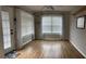 Bright room featuring wood floors, natural light, and a view of the outdoors at 804 Village Pl, Loganville, GA 30052