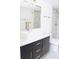 Bathroom with a white marble shower, and a black vanity with brass hardware at 2870 Pharr Court South Nw # 2507, Atlanta, GA 30305