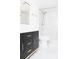 Modern bathroom featuring a white marble shower, toilet, and black vanity at 2870 Pharr Court South Nw # 2507, Atlanta, GA 30305