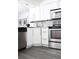 Modern kitchen featuring stainless steel appliances, granite countertops, and ample cabinet space at 2870 Pharr Court South Nw # 2507, Atlanta, GA 30305