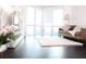 Bright living room with hardwood floors, large windows and a comfortable sofa at 2870 Pharr Court South Nw # 2507, Atlanta, GA 30305