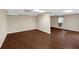 A spacious room with wood flooring, neutral walls, and a small window with natural lighting at 4701 Flat Shoals Road Rd # 37H, Union City, GA 30291
