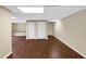 The open basement area features wood floors, and storage with double doors at 4701 Flat Shoals Road Rd # 37H, Union City, GA 30291