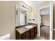 The bathroom features a dark vanity, large mirror, and a view of the bedroom at 4701 Flat Shoals Road Rd # 37H, Union City, GA 30291