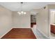 Dining area with modern lighting, tile flooring, and a view into the adjacent living room at 4701 Flat Shoals Road Rd # 37H, Union City, GA 30291