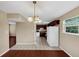 Open dining area with hardwood floors, tile flooring, and a view into the adjacent kitchen at 4701 Flat Shoals Road Rd # 37H, Union City, GA 30291