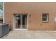 Exterior view of brick facade with sliding glass door leading to patio, plus small window and AC unit at 4701 Flat Shoals Road Rd # 37H, Union City, GA 30291