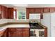 Well-equipped kitchen featuring dark cabinets, and stainless steel appliances at 4701 Flat Shoals Road Rd # 37H, Union City, GA 30291