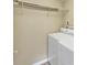 Efficient laundry room with overhead shelving to maximize storage at 4701 Flat Shoals Road Rd # 37H, Union City, GA 30291