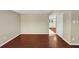 Open living room with hardwood floors, neutral paint, and a view into the adjacent dining area at 4701 Flat Shoals Road Rd # 37H, Union City, GA 30291