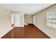 Spacious living room with hardwood floors, two entry doors, and a staircase to the upper level at 4701 Flat Shoals Road Rd # 37H, Union City, GA 30291