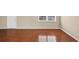 Bright living room featuring neutral paint, hardwood floors, and a window for natural light at 4701 Flat Shoals Road Rd # 37H, Union City, GA 30291