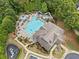 Aerial view of a community pool with lounge chairs, water slide and adjacent playground at 508 Highland Dr, Woodstock, GA 30188