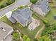 Aerial view showcasing a large backyard with a patio, fire pit, outdoor kitchen, and lush landscaping at 508 Highland Dr, Woodstock, GA 30188