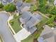 Aerial view showcasing a large backyard with a patio, fire pit, outdoor kitchen, and lush landscaping at 508 Highland Dr, Woodstock, GA 30188