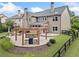 View of backyard showing patio, outdoor kitchen, and landscaped yard at 508 Highland Dr, Woodstock, GA 30188