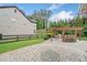 Outdoor kitchen in backyard with granite counters, grill and outdoor seating at 508 Highland Dr, Woodstock, GA 30188