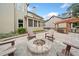 Backyard includes a fire pit with chairs and outdoor kitchen at 508 Highland Dr, Woodstock, GA 30188
