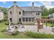 Exterior view of backyard featuring outdoor kitchen, patio, and fire pit with seating at 508 Highland Dr, Woodstock, GA 30188