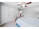 Bedroom featuring a bed, a ceiling fan, and a closet with double doors at 508 Highland Dr, Woodstock, GA 30188