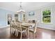 Dining room with chandelier, hardwood floors, and natural light at 508 Highland Dr, Woodstock, GA 30188