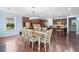 Dining room with chandelier lighting, hardwood floors, and view into kitchen at 508 Highland Dr, Woodstock, GA 30188