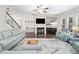 Bright living room boasts natural light, a fireplace, and comfortable furnishings at 508 Highland Dr, Woodstock, GA 30188