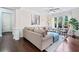 Cozy living room with dark wood floors, neutral decor, and a comfortable sectional sofa at 508 Highland Dr, Woodstock, GA 30188