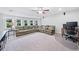 Spacious living room with large comfy sofa, ceiling fan and lots of windows at 508 Highland Dr, Woodstock, GA 30188