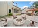 Patio with an outdoor kitchen under a pergola, complete with stone surround and a fire pit at 508 Highland Drive Dr, Woodstock, GA 30188